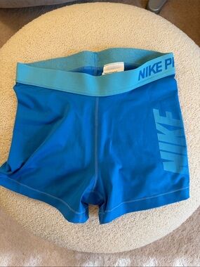 Nike Blue Athletic Compression Shorts with Teal Waistband